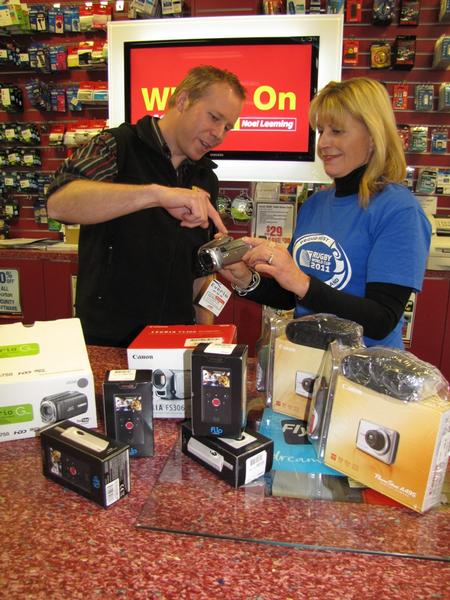 Noel Leemings Taup&#333; Manager Jay Braddock shows RWC 2011 Project Manager Karen Balasoglou the prizes for the Taup&#333; Schools Multimedia Competition.